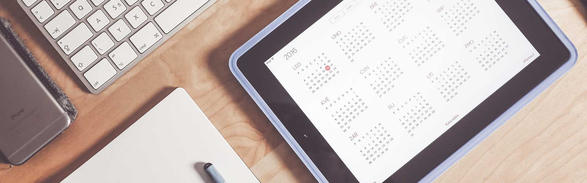 How to travel when you work full time - Shows desk with planner